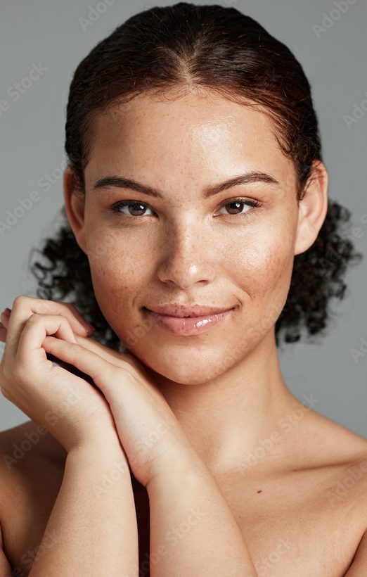 Health, natural and black woman skincare portrait for beauty cosmetic and glow treatment campaign. Healthy body care of model happy with beautiful freckles on face in gray studio background.